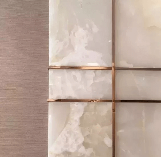 close up design of stone with gold steel