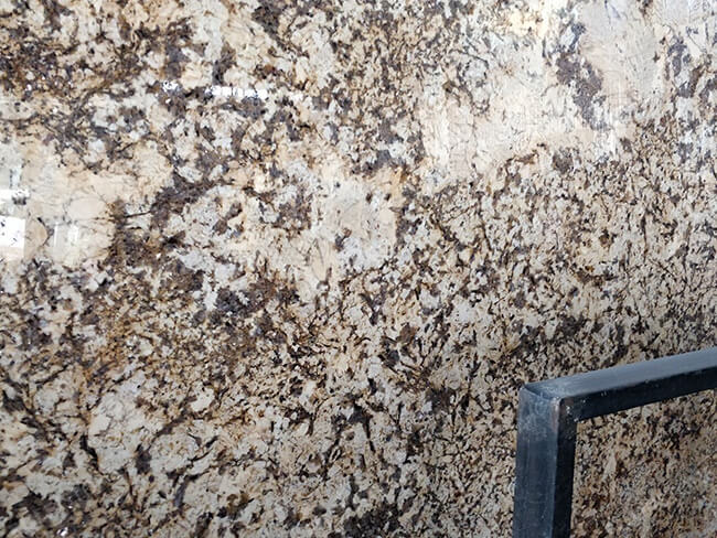 close up of polished crema delicatus granite